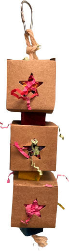 Stacked brown cardboard boxes with star cutouts, each containing colorful shredded paper, hanging from a metal ring.