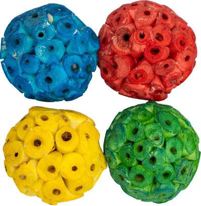Four colorful Sola Balls in blue, red, yellow, and green, each with circular segments and central holes, close-up view.