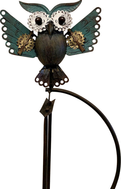 Front view of Esschert Design metal mechanical owl weather vane with teal wings and gold gears.