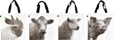 Four white shopping bags with black handles, each featuring a monochrome farm animal portrait: rooster, cow, sheep, pig.
