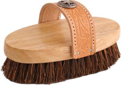 Close-up of a tan leather strap with star emblem attached to an oval wooden base with brown bristles.