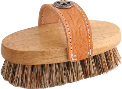 Close-up of Legends Union Cowboy Heavy Grooming Brush in tan, 7.5 inch size, showing wooden base, leather strap with star emblem, and natural bristles.
