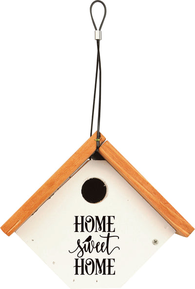 Front view of a white farmhouse-style birdhouse with wooden trim and 'HOME sweet HOME' text.
