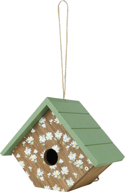 Green wooden birdhouse with white daisy pattern hanging by twine, front view.