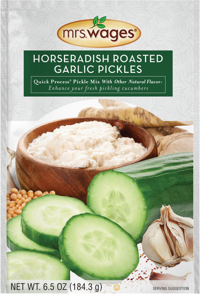 Packaged product: Mrs. Wages Horseradish Roasted Garlic Pickles mix, 6.5 oz, showing cucumbers, garlic, and pickling mix in a wooden bowl.