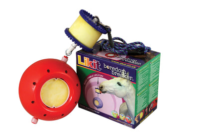Red Likit Boredom Breaker horse toy with yellow center and blue rope, next to its box.