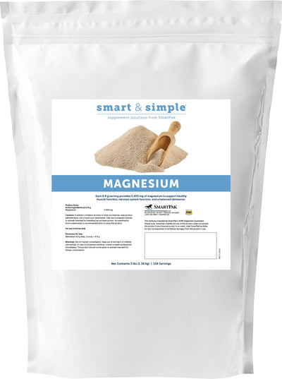 Front view of a white packaged product labeled 'smart & simple MAGNESIUM' with a scoop in a pile of powder.