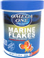 Front view of Omega One Marine Flakes container with blue lid, garlic flavor, 1 oz size, showing fish illustration and text labels.