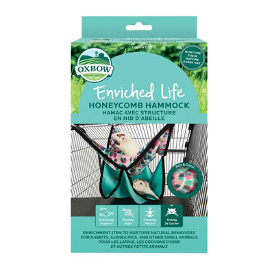 Packaged Oxbow Enriched Life Honeycomb Hammock in pink and green patterned fabric with a hamster inside.