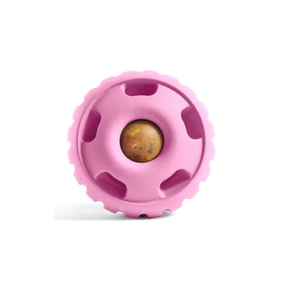 Close-up of a pink Woof Pupsicle Birthday treat with a small, round, speckled center.