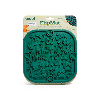 Packaged Woof FlipMat green lick mat with 'What a time to be a dog!' text and dog-themed designs.