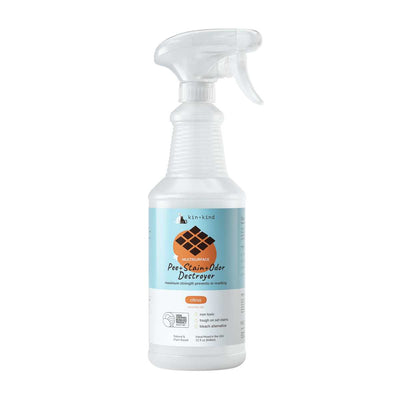 Front view of a white spray bottle with a light blue label showing "kin+kind Pee+Stain+Odor Destroyer" and "citrus" flavor.