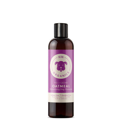 Front view of a Kin Organics Fig + Cedar Oatmeal Moisturizing Dog Shampoo bottle, 12 fl oz, purple label on brown bottle.