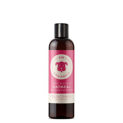 Front view of a Kin Organics Sweet Blossom Oatmeal Moisturizing Dog Shampoo bottle, 12 oz, pink label on dark bottle.