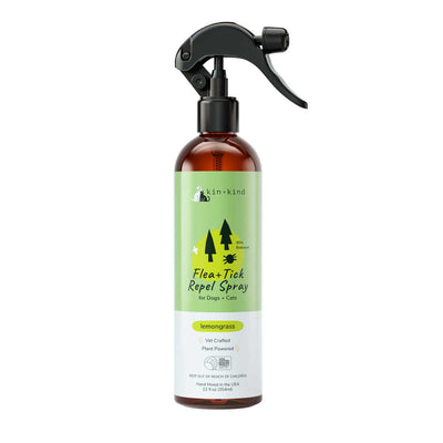 Front view of a Kin+kind Flea+Tick Repel Spray bottle with lemongrass scent, 12 oz size, amber glass with green label.