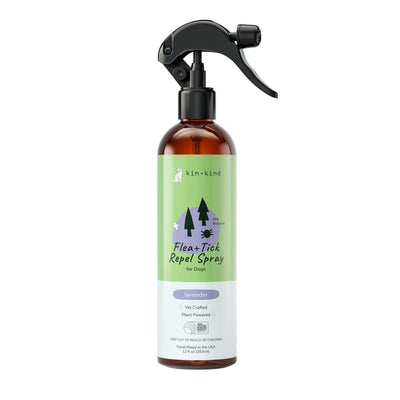 Front view of a Kin+kind Flea+Tick Repel Spray for Dogs in lavender, 12 fl oz, amber bottle with black spray nozzle.