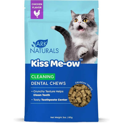 Front view of Ark Naturals Kiss Me-ow Cleaning Dental Chews in chicken flavor, 3 oz package with blue and light blue background.