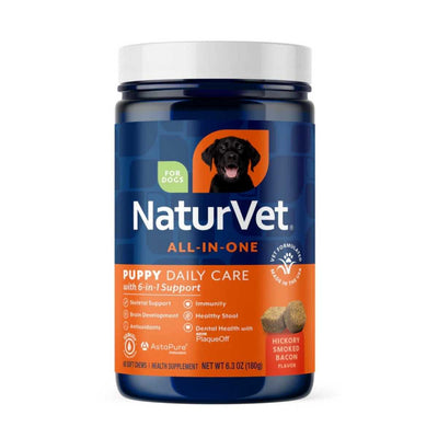 Front view of a blue and orange NaturVet puppy daily care soft chew jar with hickory smoked bacon flavor.