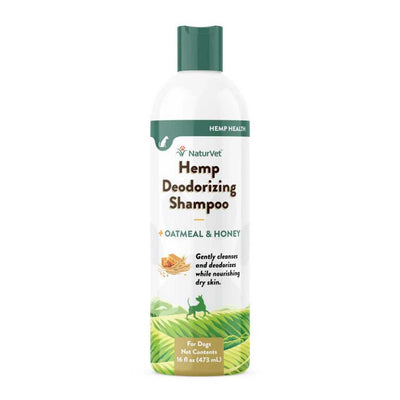 Front view of a white bottle with green cap labeled NaturVet Hemp Deodorizing Shampoo for Dogs, 16 fl oz
