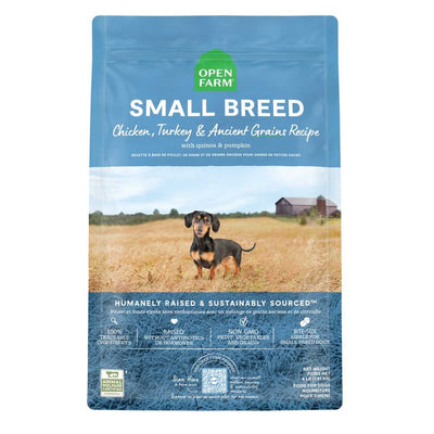 Front view of Open Farm Small Breed dog food bag with blue packaging, showing a dachshund in a field.