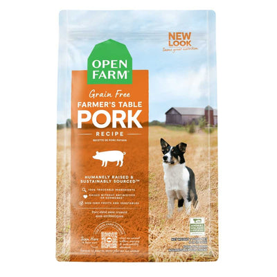 Front view of Open Farm Grain Free Farmer's Table Pork Recipe dog food bag, 4 lb, orange and green packaging with dog image.