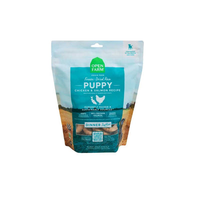 Front view of Open Farm Freeze-Dried Raw Puppy Chicken & Salmon Dinner Patties in a blue and green bag.