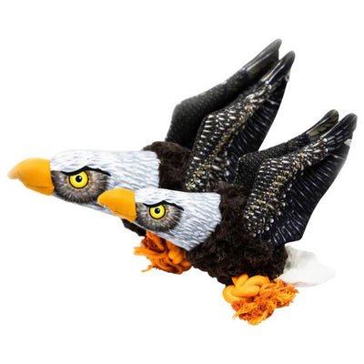 Close-up of a plush eagle toy with yellow beak, black and white feathers, and orange accents.