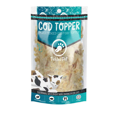 Front view of a packaged Tickled Pet Cod Topper for cats, 3 oz bag with dried minced cod visible through clear plastic.