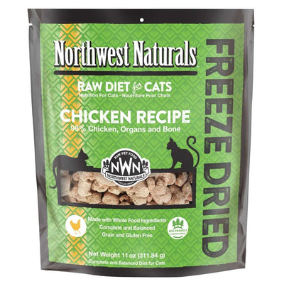 Front view of a Northwest Naturals Freeze Dried Chicken Recipe cat food bag, green and black packaging with a window showing the product.