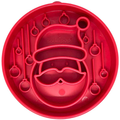 Red circular Soda Pup nylon enrichment toy mold with Santa Claus design and hanging rings, close-up view