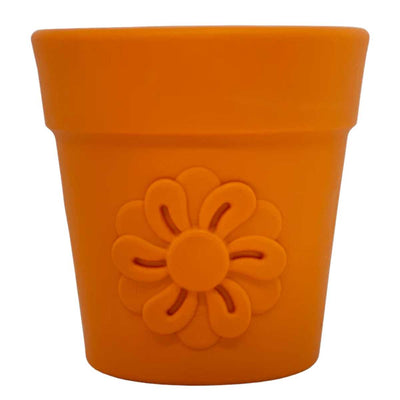 Close-up of an orange flower pot with a raised flower design on the front.
