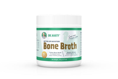 Front view of a white container with green accents labeled Dr. Marty Better Life Boosters Bone Broth Powder