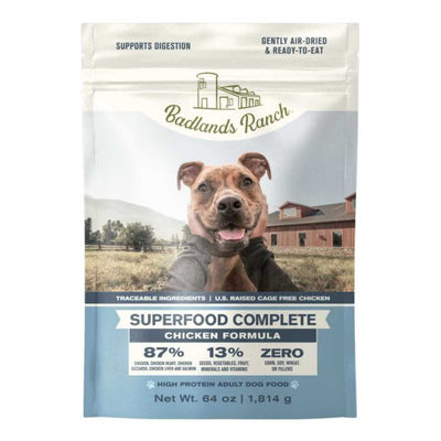 Front view of Badlands Ranch Superfood Complete Chicken Formula dog food package, 64 oz, blue and white design