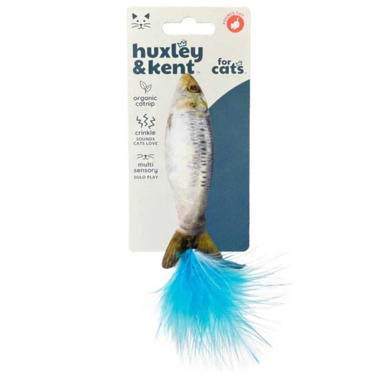 Packaged Huxley & Kent cat toy shaped like a sardine with blue tail feathers.