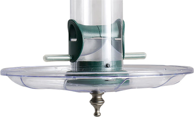 Close-up of a clear plastic seed tray with green accents and a metal hanger, showing the base and central tube.