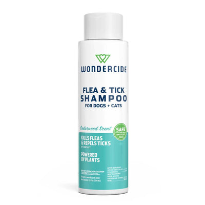 Front view of a white and teal packaged Wondercide flea and tick shampoo bottle for dogs and cats.