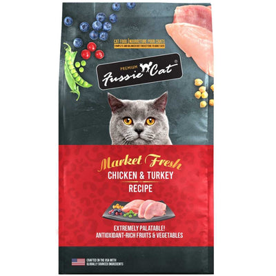Front view of a Fussie Cat premium cat food bag with chicken and turkey recipe, red and dark green packaging.