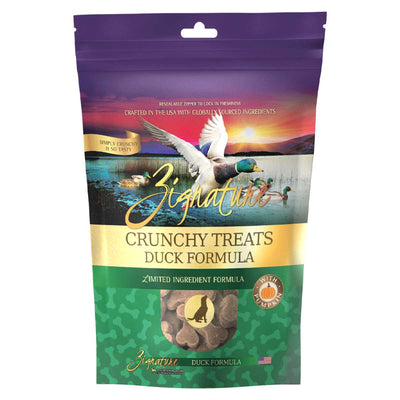 Front view of a purple, gold, and green packaged product labeled Zignature Crunchy Treats Duck Formula.