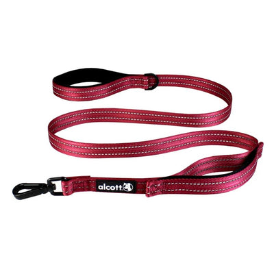 Red Alcott traffic leash with handle, accessory ring, and black metal clip in close-up.
