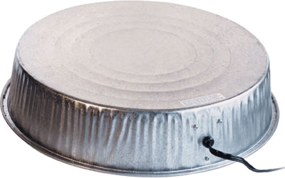 Close-up of a metallic heated base with a circular top, visible wiring, and a label on its side.