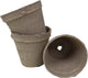 Three brown biodegradable seed starter pots, one upright, one tilted, one open, close-up detail