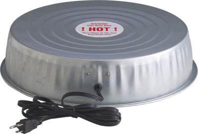 Close-up of a silver electric heater base with a warning label and power cord.