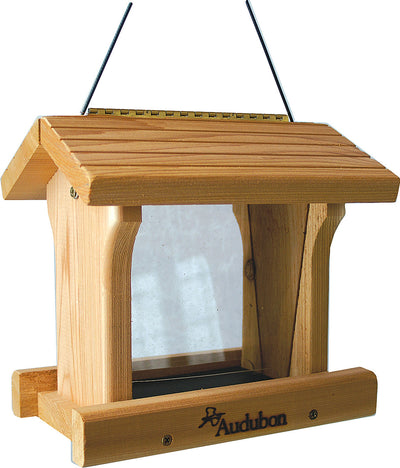 Front view of a wooden Audubon bird feeder with a transparent window and hanging wires.