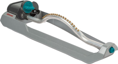 Gilmore rectangular sprinkler metal with blue knob and brass fittings, side view close-up
