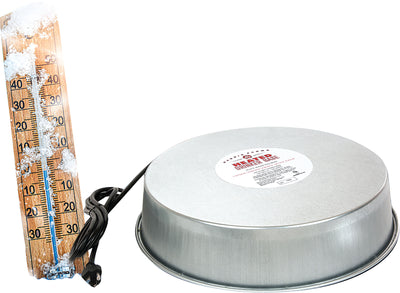 A silver Heated Drinker Base with a label and a thermometer showing snow on its wooden scale.