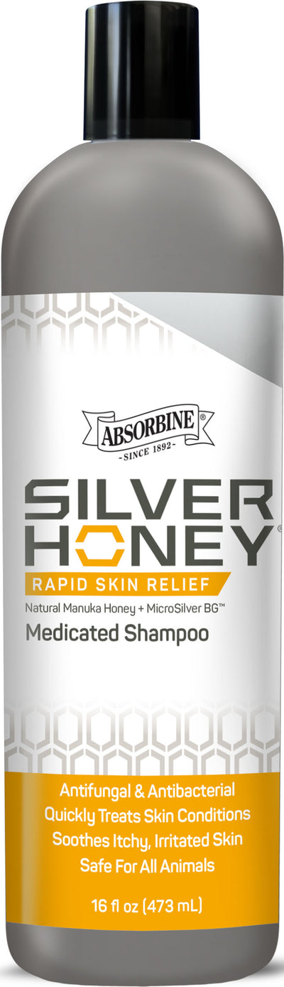Front view of Absorbine Silver Honey Medicated Shampoo bottle, 16 fl oz, gray and white label with orange accents