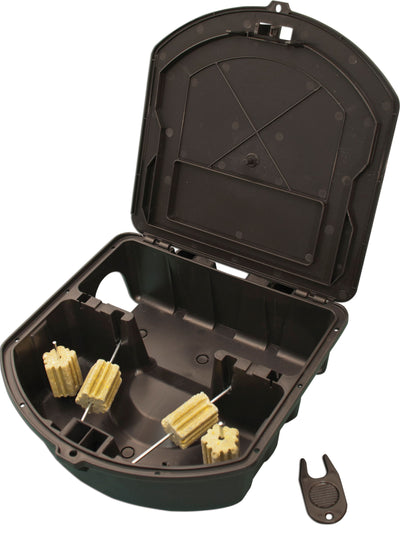 Open black Rodent Cafe Bait Station with four bait blocks on rods and a small tool beside it.