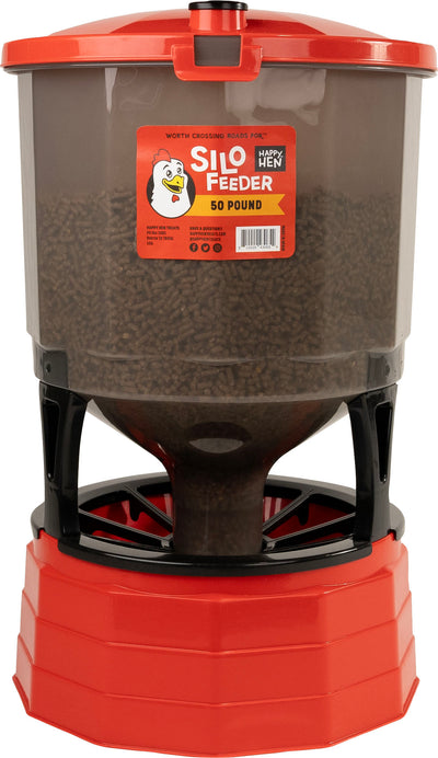 Red and clear plastic Happy Hen Silo Feeder with 50-pound capacity, front view, packaged product