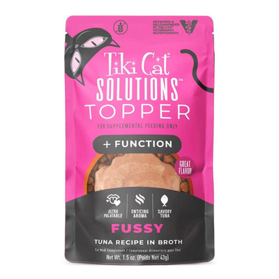 Front view of a pink and black packaged Tiki Cat Solutions Topper Fussy Tuna Recipe in Broth pouch.