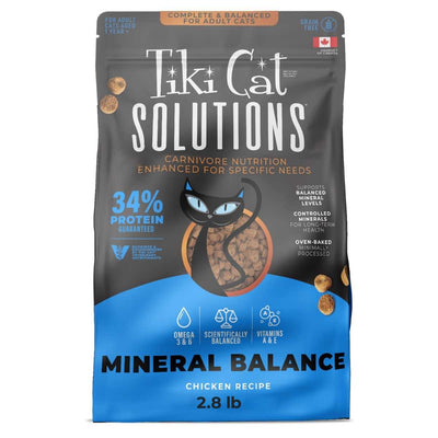 Front view of Tiki Cat Solutions Mineral Balance chicken recipe cat food in a 2.8 lb package with blue and black colors.